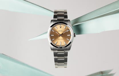 Rolex Oyster Perpetual suspended among paper airplanes