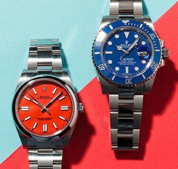 Rolex Oyster Perpetual and Rolex Submariner Smurf blue dial watches side-by-side