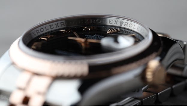 Close-up of rehaut engraving with ROLEX text and coronet logo